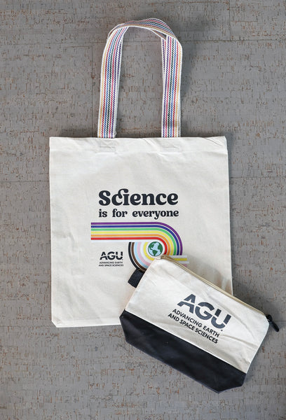 A small zippered pouch with the AGU logo printed in black is pictured with a cotton tote bag printed with the slogan "Science is for everyone"