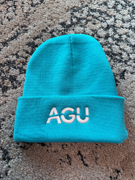 A bright blue beanie with AGU logo embroidered in white