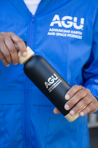 Stainless steel water bottle with the AGU logo on a black background