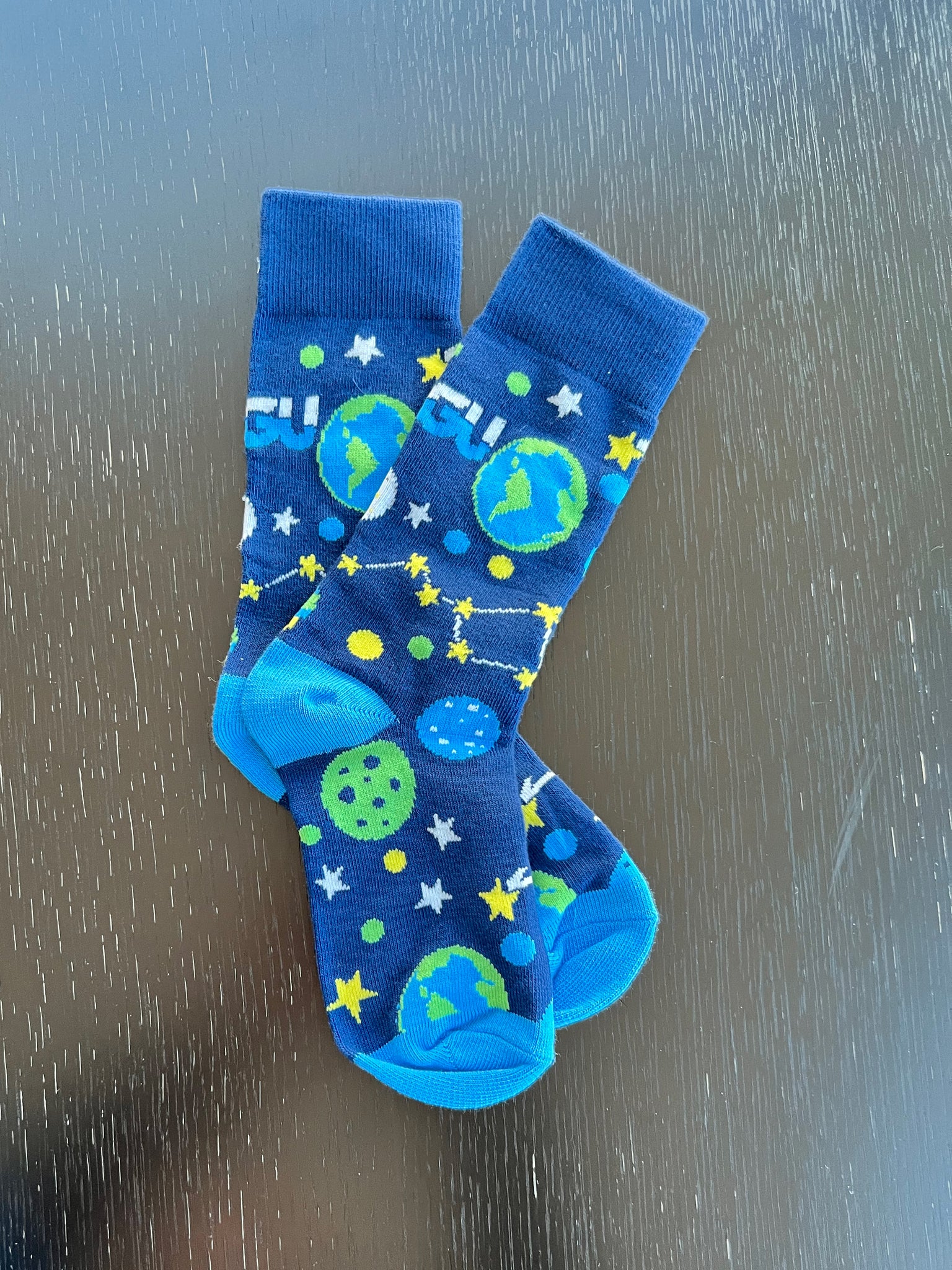 Pair of AGU socks in blue, green and yellow