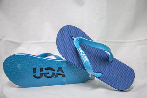 Flip flops in two tones of blue with AGU logo imprinted on the sole